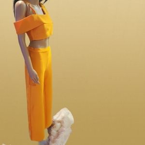 Selling an orange bandage two piece suit. Never worn.